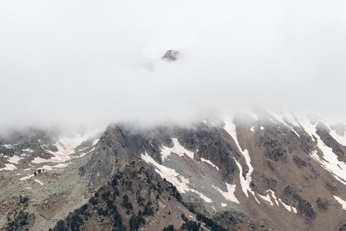 Rocky mountains covered with snow on sunny day
