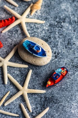 Top view of sea shells and fishing boat toys