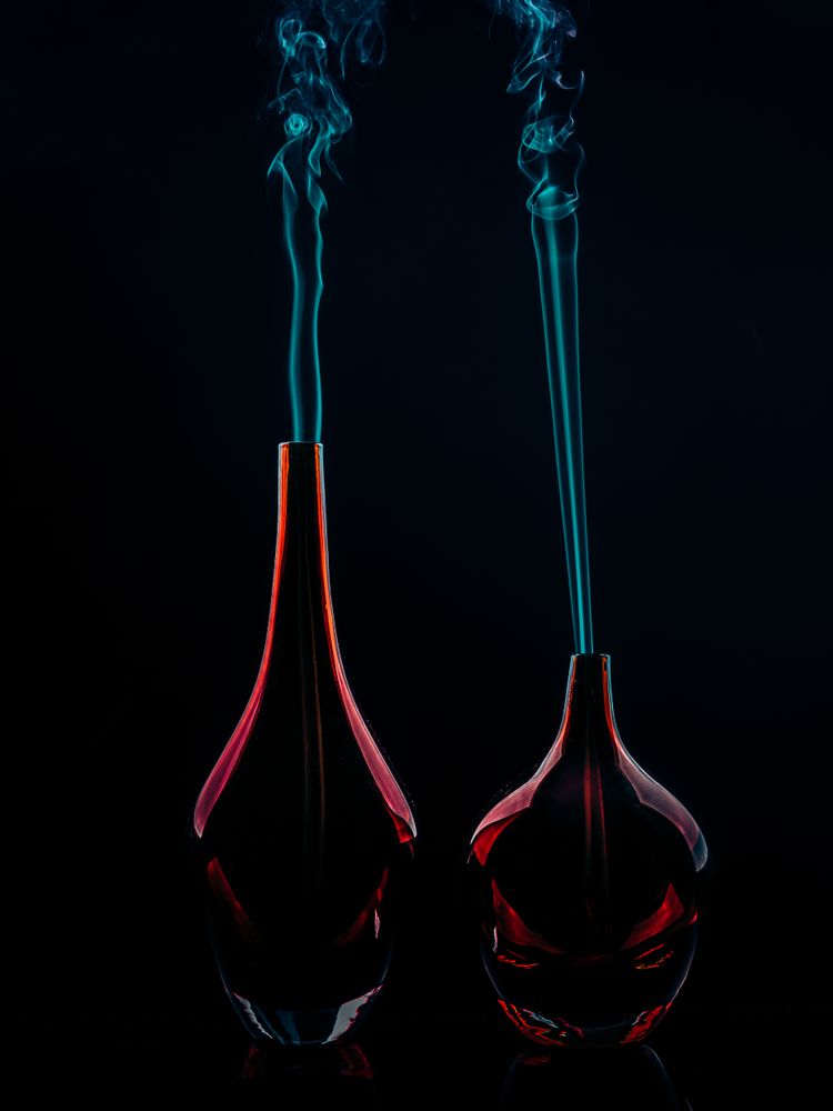 Glass bottles emitting smoke