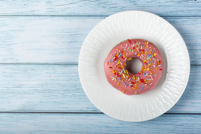 Delicious assorted colorful donuts on the table.