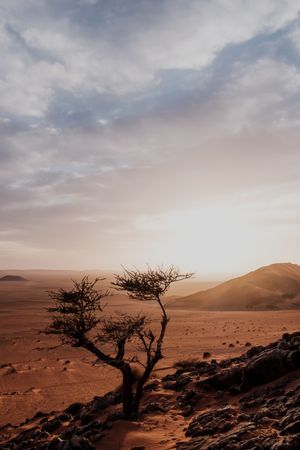 Sunset sky over hills in desert