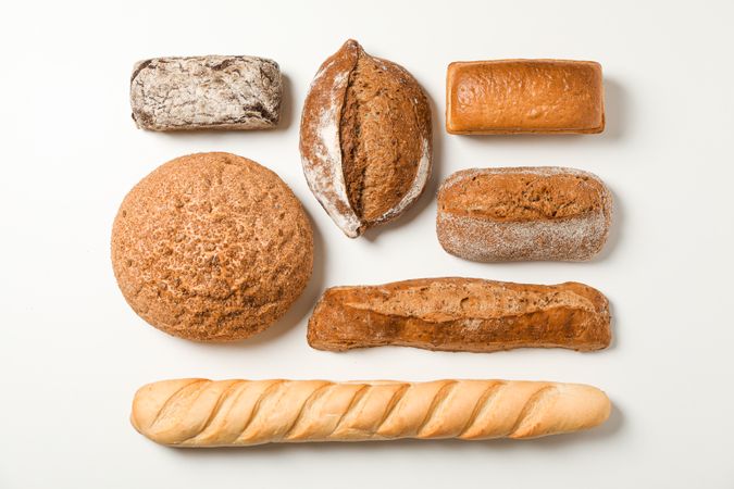 Flat lay composition with bakery products on blank background, space for text