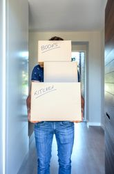 Man carrying moving boxes