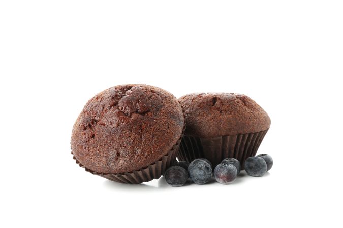 Delicious chocolate muffins isolated on blank background