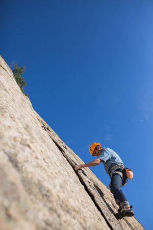 Free climber climbing in nature