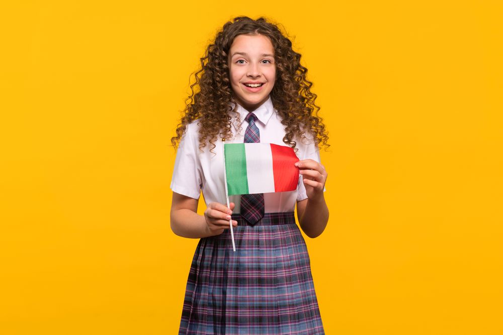 Smiling girl holding Italian flag