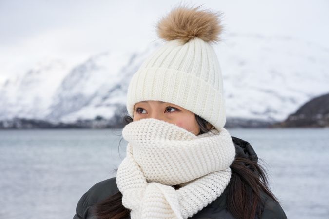 Joyful young woman in warm clothes