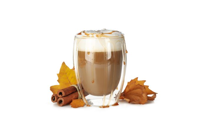 Glass of latte isolated on neutral background