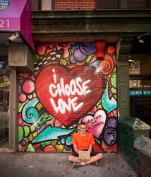 A homeless person asks for donations in Lower Manhattan's Chinatown, New York City, New York