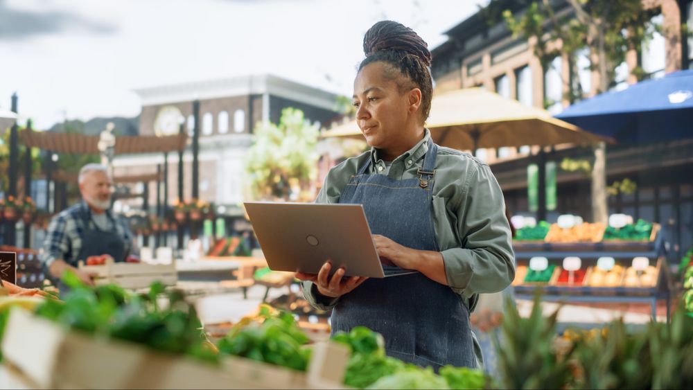 Black Female Managing Business Operations and Communications with Suppliers