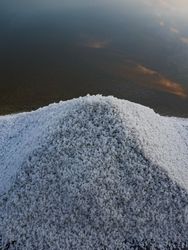 Salt mound on the edge of its salt pan