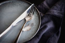 Table setting for Easter dinner with feather detail