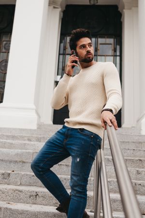 Trendy young male using smartphone