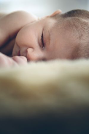 Baby sleeping on a blanket
