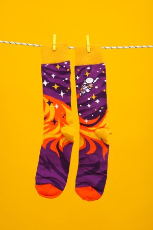Concept of clothes for legs - socks, socks hanging on rope