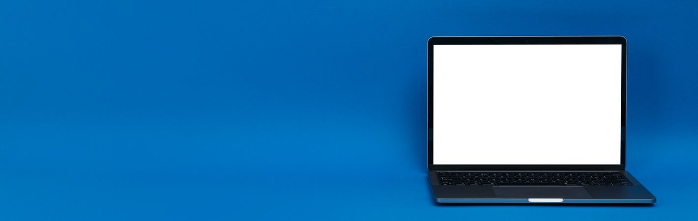 Banner of blue room with laptop with mockup screen