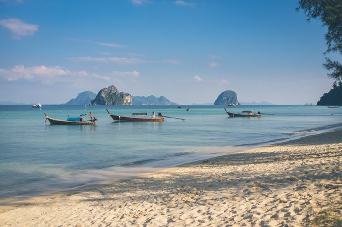 Boats near sandy beach