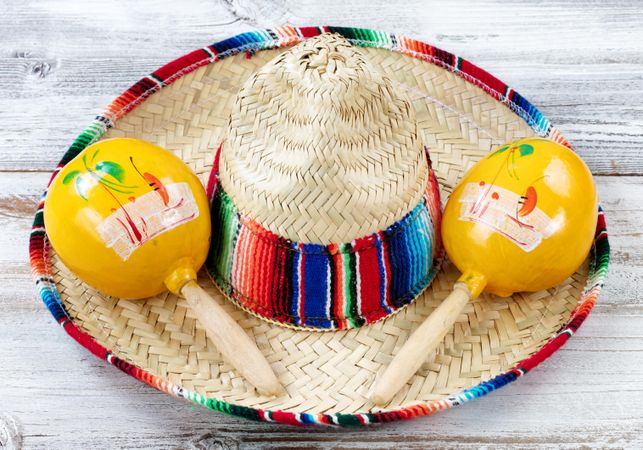 Close up view of traditional Cinco De Mayo objects on white weathered wood