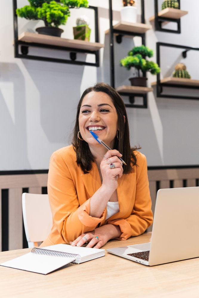Content woman working on project in cafe