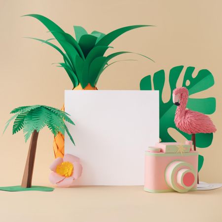 Palm tree, pineapple and flamingo made of paper on beige background