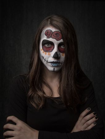 Young woman with creepy face paint