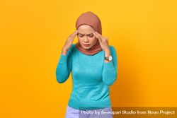 Upset Muslim woman with hand on her face lost in thought 4B9GW5