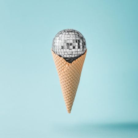 Disco ball ice cream on bright blue background