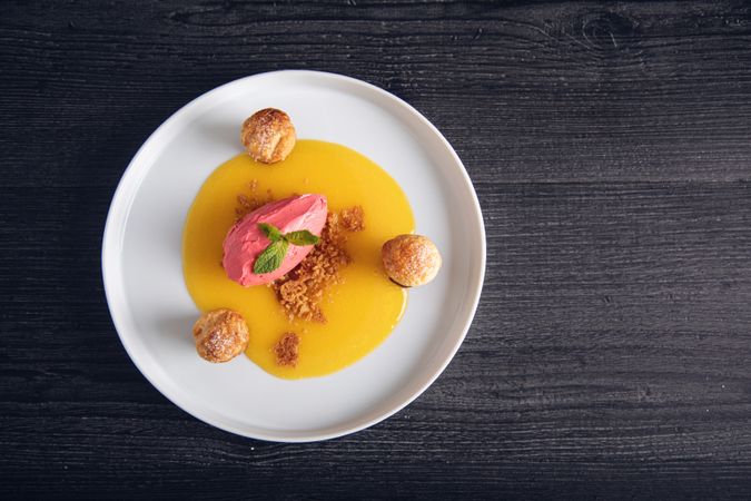 Raspberry ice cream with curable oranges chocolate and puff pastry