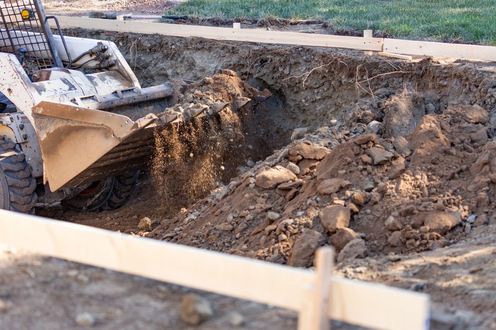 Small Bulldozer Digging In Yard For Pool Installation