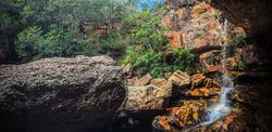 Small waterfall in rugged terrain