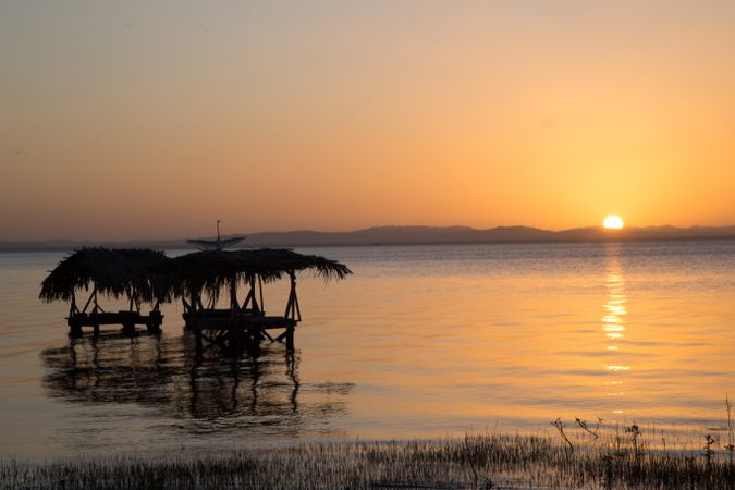 Laundry in sea at sunset