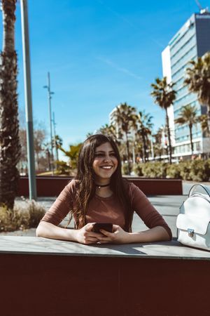 Teen girl looking at her smartphone.
