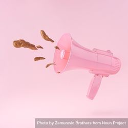 Pink megaphone with feces coming out of it against pastel pink background bYNQ60