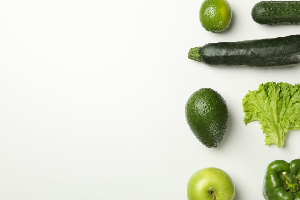 Vegetables and fruits on blank background, space for text