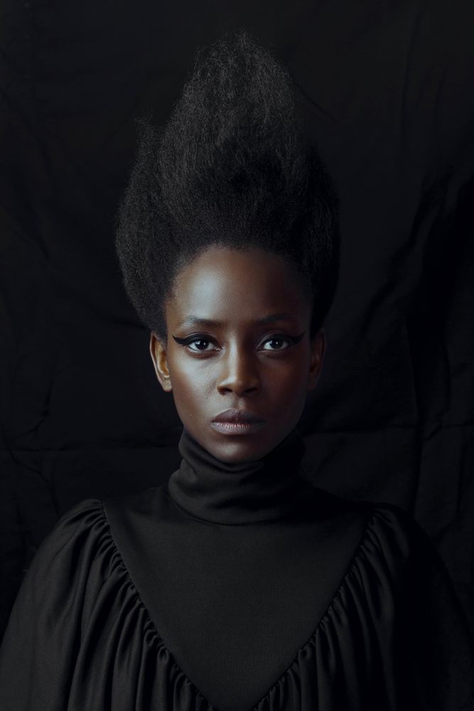 Portrait of Black woman wearing turtleneck shirt