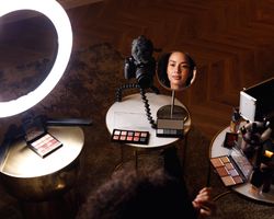 Beauty blogger making cosmetics tutorial for her online channel