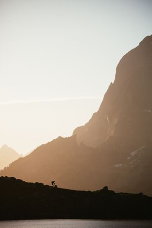 Majestic mountain landscape with human silhouette