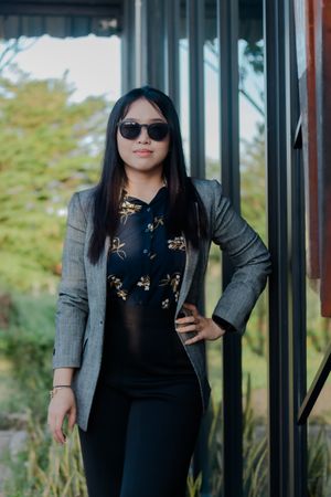 Confident Woman in Business Attire Posing Outdoors Professionall
