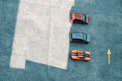 Three vehicles parked on a rooftop