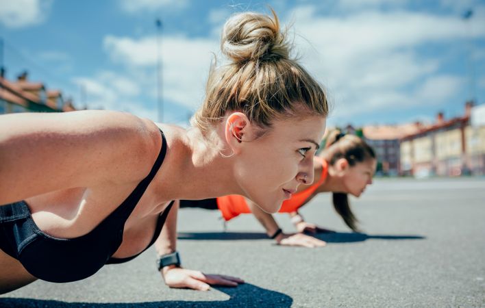 Sportswomen doing push-ups