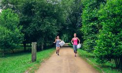 Two women doing plogging