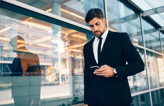 Business traveler looking at cellphone