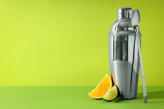 Concept of preparing cocktail, shaker, space for text