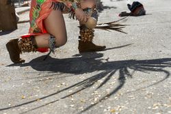 Des Moines, Iowa, USA - September 26, 2015:  An Aztec dancer kneels during a performance 5l6VYb