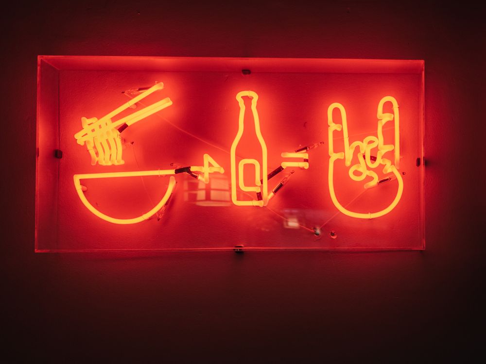Neon signboard on red background