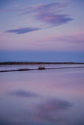 Sunset sky reflecting in calm water