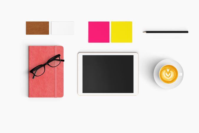 Modern workspace with coffee cup, smartphone, paper, notebook and tablet copy space
