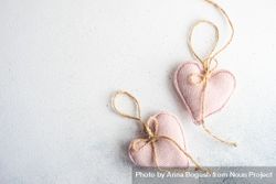 Valentine Day holiday card concept with felt pink heart decorations on marble counter 5aXXxW