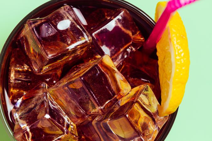 Drink in glass with ice and lemon
