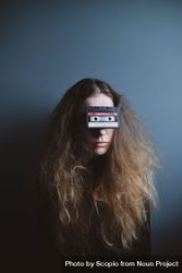 Portrait of woman with cassette on her eyes 5lMEY4